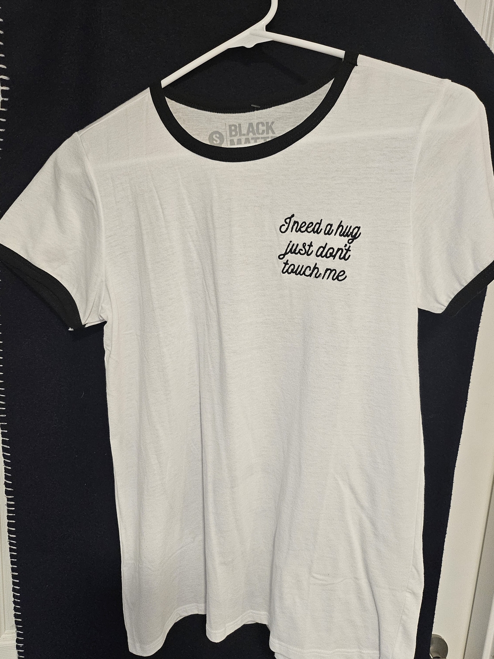 Hot Topic White Tee with Black Trim "I Need A Hug.." Script On Left Chest